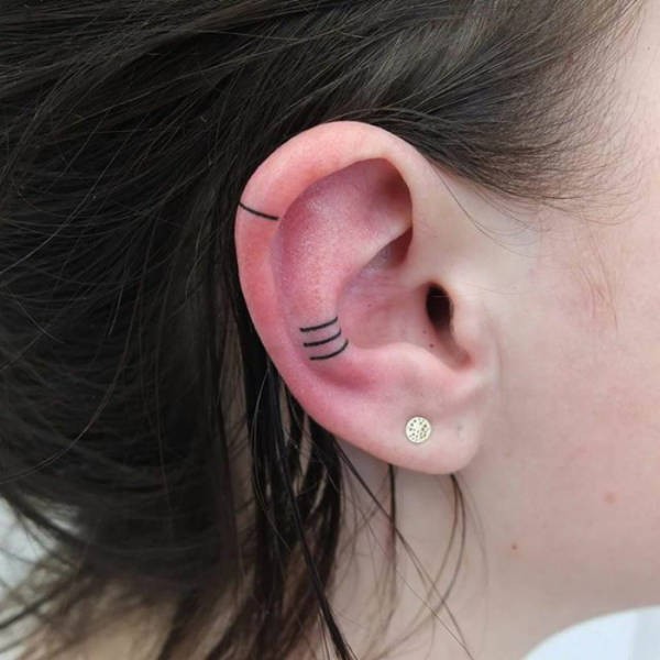 Татуировки на ушах (35 фото)